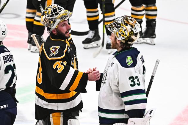 Wheeling Nailers goaltender Taylor Gauthier shakes hands with Maine Mariners goaltender Luke Cavallin