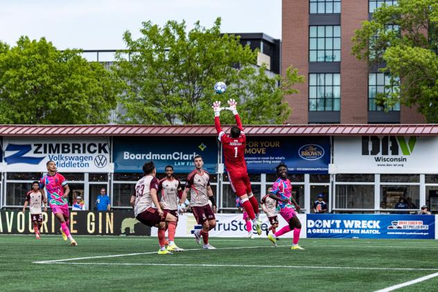 Detroit City FC goalkeeper Carlos Herrera leaps to make a save