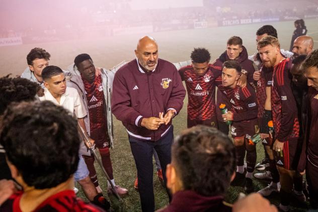 Detroit City FC huddle around Head Coach Danny Dichio