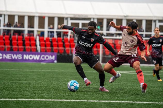 Detroit City FC forward Alex Dalou (right) vs. Loudoun United