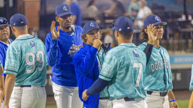 Lake Country DockHounds exchange high fives after a win