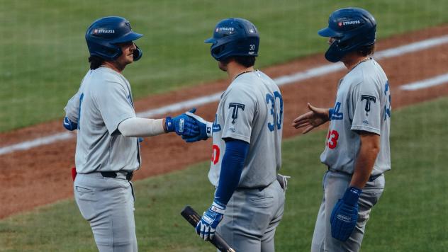 Tulsa Drillers congratulate Jake Gelof after a homer