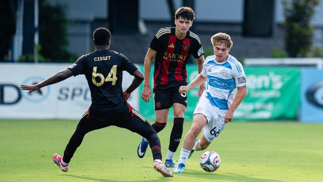 Atlanta United 2's Mohamed Cisset and Ignacio Suarez-Couri and Chicago Fire II's Chase Nagle on the field
