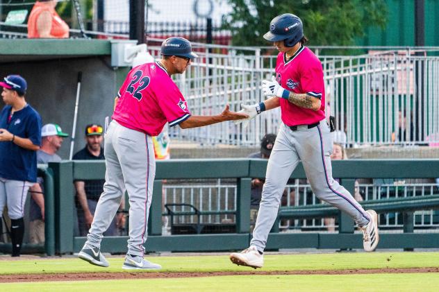 Pensacola Blue Wahoos' coach Nelson Prada congratulates Aiva Arquette