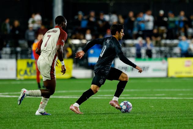 Sacramento Republic FC's Mayele Malango and Colorado Springs Switchbacks FC's Rashed Jahan in action