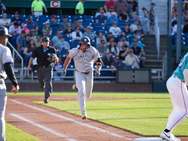 Garrett Martin of the Somerset Patriots heads for first