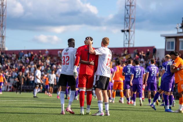 Detroit City FC consoles goalkeeper Carlos Herrera