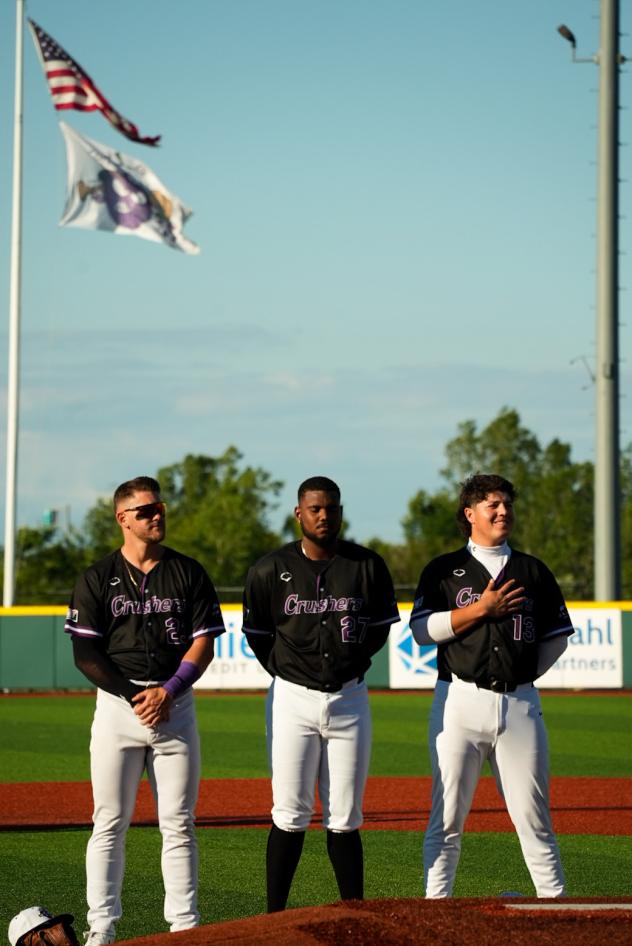 Lake Erie Crushers line up for the National Anthem