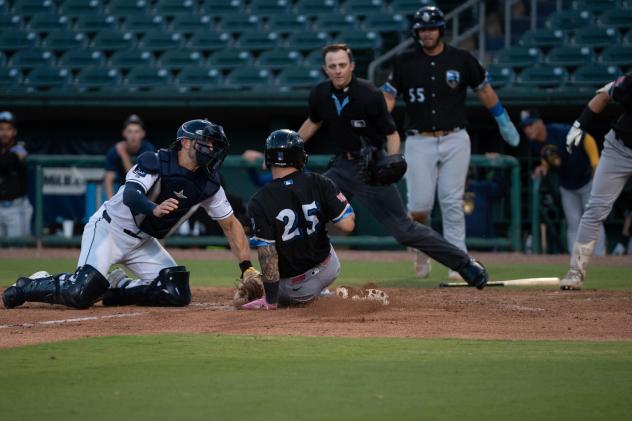 Montgomery Biscuits catcher Kenny Piper applies the tag
