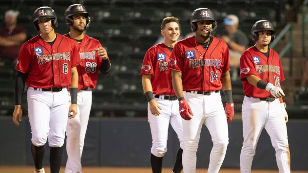 Hickory Crawdads a happy bunch walking off the field