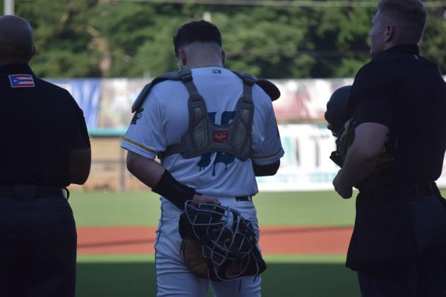 Mississippi Mud Monsters catcher Andrew Semo during the National Anthem