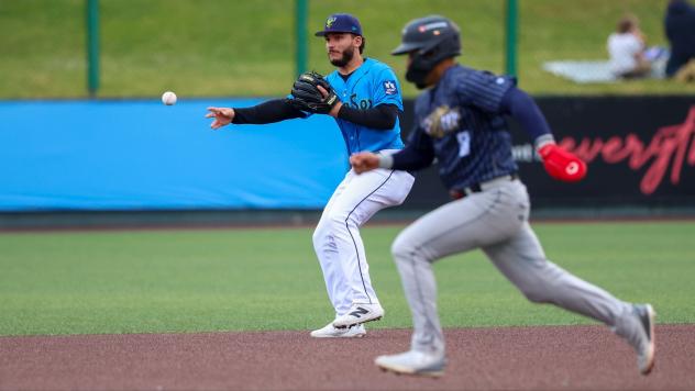Everett AquaSox shortstop Axel Sanchez makes a throw