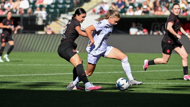 Racing Louisville FC with possession vs. the Portland Thorns