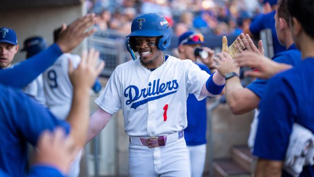 Kendall George is welcomed by Tulsa Drillers teammates