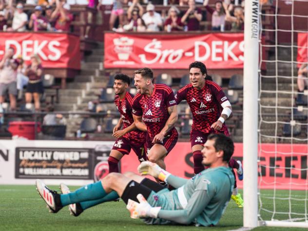 Detroit City FC react following a goal