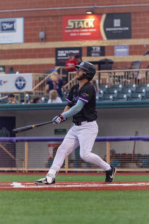 Lake Erie Crushers watch a long fly ball