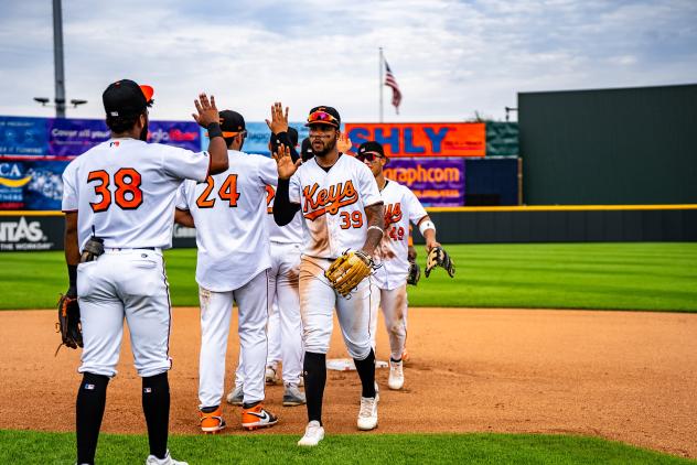 Frederick Keys exchange high fives after a win