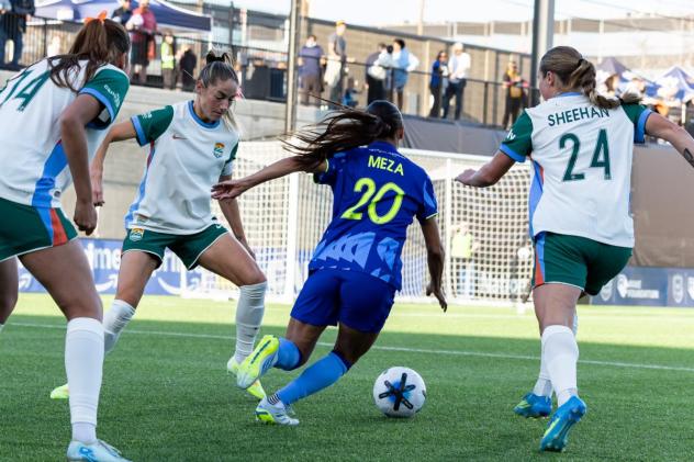 Seattle Reign FC midfielder Sam Meza seeks a gap in the defense