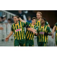 Rochester Rhinos Tony Walls (No. 20) Celebrates with Rochester Teammates