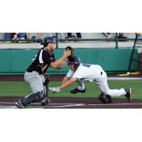 Cal Stevenson of the Duluth Huskies Slides Home