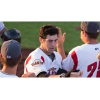 Ronnie Jebavy of the Salem-Keizer Volcanoes is Congratulated after a Homer