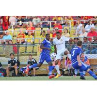 Fort Lauderdale Strikers Forward Stefano Pinho vs.  FC Edmonton's Kareem Moses (12) and Albert Watson (5)