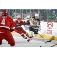 Andre Benoit of the Chicago Wolves Controls the Puck vs. the Charlotte Checkers