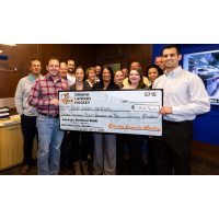Omaha Lancers Present Check to Scare Away Cancer
