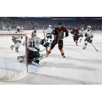 Justin Hodgman of the Chicago Wolves Takes a Shot vs. the Iowa Wild