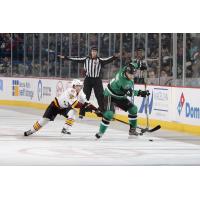 Chicago Wolves F Evan Trupp Tries to Control the Puck vs. the Texas Stars