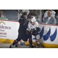 Chicago Wolves LW Emerson Clark Crunched against the Boards by the Lake Erie Monsters