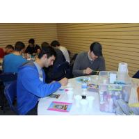 Spiro Goulakos and Matt Prapavessis work on their paintings