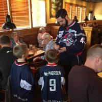 Ian Young of the Elmira Jackals Signs an Autograph