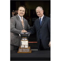 Brent Thiessen of the Missouri Mavericks (left) Accepts the Brabham Cup from ECHL Commissioner Brian McKenna