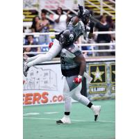 Wondell Rutledge of the Duke City Gladiators Lifts Dello Davis after a Davis Touchdown