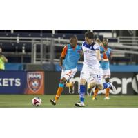 FC Edmonton Battles for the Ball vs. Miami FC