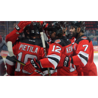 Binghamton Devils congratulate Nick Lappin on his goal