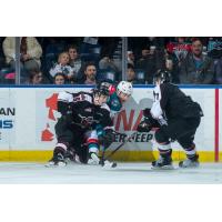 The Vancouver Giants battle the Kelowna Rockets for the puck