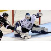 Victoria Royals Goaltender Griffen Outhouse stops a Vancouver Giants shot