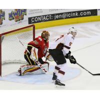Cleveland Monsters Goaltender Matiss Kivlenieks holds off the Stockton Heat