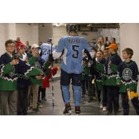 Jack Dougherty of the Milwaukee Admirals greets kids during a game