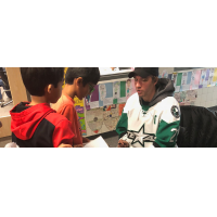 Travis Morin of the Texas Stars signs autographs for young fans