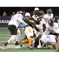 The Arizona Rattlers run the ball against the Cedar Rapids Titans