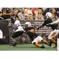 Ryan Langford of the Arizona Rattlers holds on to a Cedar Rapids Titans ballcarrier