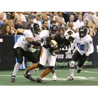 Shadrach Thornton of the Arizona Rattlers powers for yardage vs. the Cedar Rapids Titans