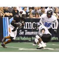Shadrach Thornton of the Arizona Rattlers looks for a hole against the Cedar Rapids Titans