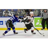 Bowen Byram of the Vancouver Giants skates through the Victoria Royals
