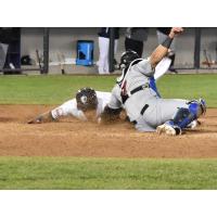 Justin Trapp of the Somerset Patriots scores the winning run on opening day