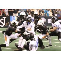 Arizona Rattlers close in on a Cedar Rapids Titans ballcarrier