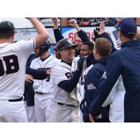 Scott Kelly receives congratulations from his Somerset Patriots teammates